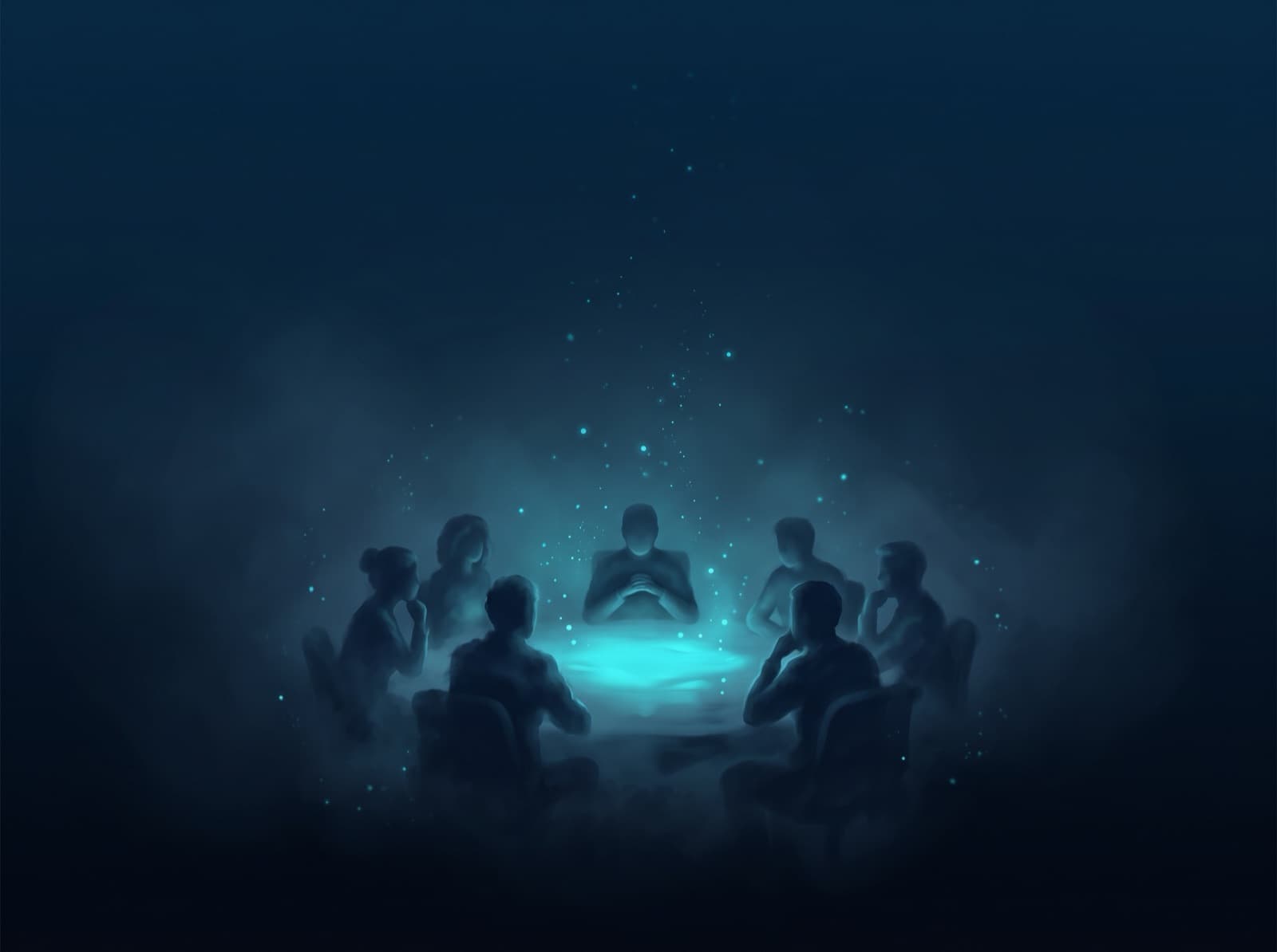 A group of colleagues sitting silently around a table